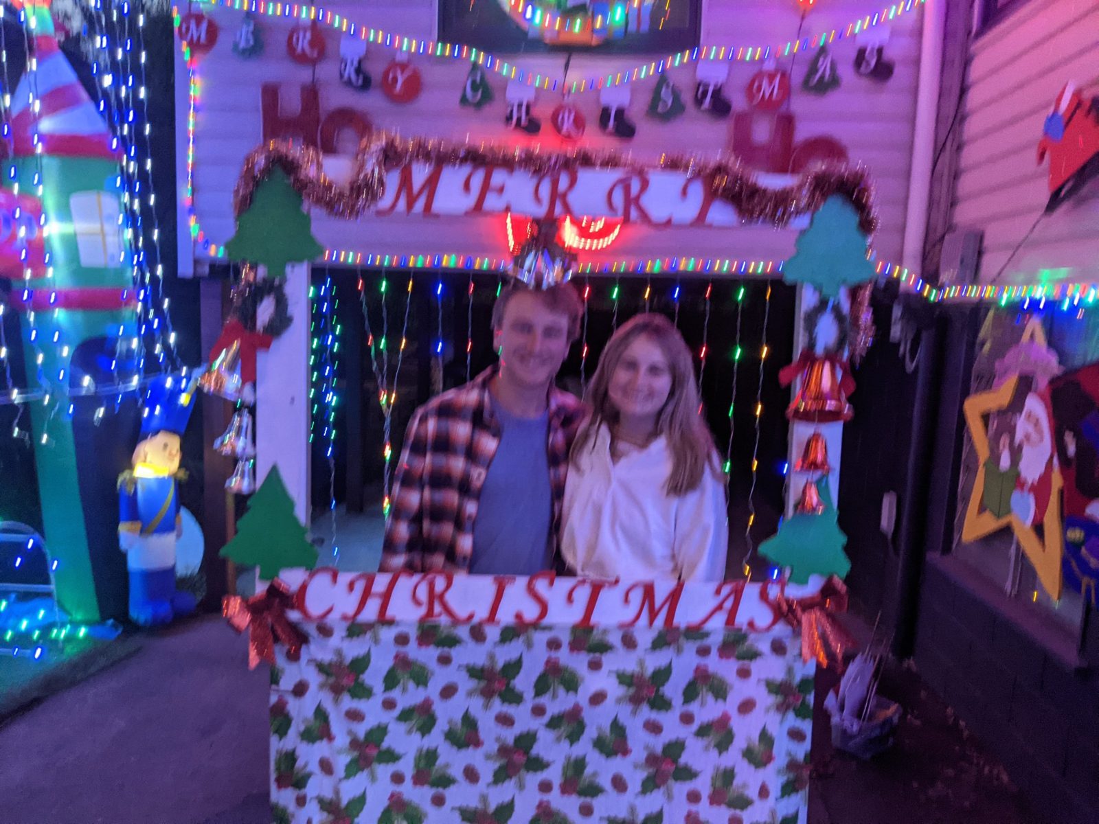 Maggie and Jack in a Christmas lights frame